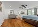 A spacious main bedroom with hardwood floors, walk in closet, and a ceiling fan at 1302 Ladd St, Atlanta, GA 30310