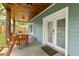 Relaxing outdoor patio with wood ceiling, comfortable seating, and a welcoming entrance at 1302 Ladd St, Atlanta, GA 30310