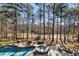 Aerial view of backyard featuring a swimming pool, hot tub, outdoor seating, and fire pit at 2250 Blackheath Trce, Alpharetta, GA 30005