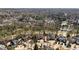 Aerial view of a neighborhood featuring tree lined streets, beautiful homes, and lake views at 2250 Blackheath Trce, Alpharetta, GA 30005