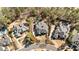 Aerial view of beautiful homes within a neighborhood with mature trees and pristine landscaping at 2250 Blackheath Trce, Alpharetta, GA 30005