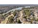 An aerial view of a neighborhood, houses, a golf course and a lake in a wooded area at 2250 Blackheath Trce, Alpharetta, GA 30005