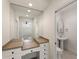 A light and bright bathroom featuring a vanity and toilet area, lots of white walls and doors at 2250 Blackheath Trce, Alpharetta, GA 30005