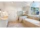 Bathroom featuring a soaking tub, walk-in shower and vanity with double sinks at 2250 Blackheath Trce, Alpharetta, GA 30005