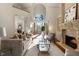 Bright living room with fireplace, built-in shelves, and access to a balcony at 2250 Blackheath Trce, Alpharetta, GA 30005