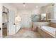 This main bathroom features a soaking tub, glass enclosed shower, and double sink vanity at 2250 Blackheath Trce, Alpharetta, GA 30005