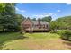 Expansive backyard featuring a wooden deck, perfect for outdoor entertaining and relaxation at 3500 Thunderwood Ln, Snellville, GA 30039
