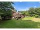 Well-maintained backyard with a wooden deck, offering a serene outdoor space at 3500 Thunderwood Ln, Snellville, GA 30039
