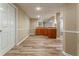 Basement featuring wood-look floors, cabinets, and a wet bar area at 3500 Thunderwood Ln, Snellville, GA 30039