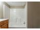 Bathroom featuring a modern shower and oak cabinets at 3500 Thunderwood Ln, Snellville, GA 30039
