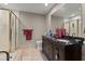 Bathroom featuring tiled shower, double sink vanity, and mirror at 3500 Thunderwood Ln, Snellville, GA 30039