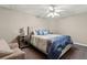Bedroom featuring a queen bed with upholstered headboard, carpet and neutral walls at 3500 Thunderwood Ln, Snellville, GA 30039