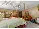 Bedroom features a four-poster bed, ceiling fan, and neutral decor with touches of floral patterns at 3500 Thunderwood Ln, Snellville, GA 30039