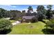 Charming home with a well-manicured front lawn and a circular garden feature at 3500 Thunderwood Ln, Snellville, GA 30039