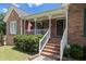 Inviting front porch with white railings and brick steps leading to the entryway at 3500 Thunderwood Ln, Snellville, GA 30039