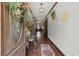 Elegant hallway featuring hardwood floors, decorative moldings, and a stylish entryway table at 3500 Thunderwood Ln, Snellville, GA 30039
