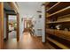 Inviting hallway with hardwood floors and decorative built-in shelving at 3500 Thunderwood Ln, Snellville, GA 30039