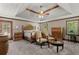 Main bedroom features decorative ceiling, furniture, and natural light at 3500 Thunderwood Ln, Snellville, GA 30039