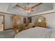 Bedroom with decorative furniture, ceiling fan, and natural light at 3500 Thunderwood Ln, Snellville, GA 30039
