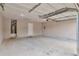 Spacious garage with room for storage and a modern door system at 420 Spring Lake Ter, Covington, GA 30016