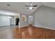 Open-concept living area with wood floors connects dining, kitchen, and living spaces at 420 Spring Lake Ter, Covington, GA 30016
