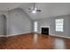 Bright living room with hardwood floors, a fireplace, and ample natural light at 420 Spring Lake Ter, Covington, GA 30016