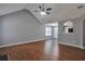 Spacious living room features wood floors, vaulted ceilings, and neutral paint at 420 Spring Lake Ter, Covington, GA 30016