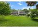 Spacious backyard with lush greenery, offering a serene and private outdoor space at 580 Lilburn School Rd, Lilburn, GA 30047