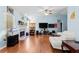 Bright living room with a vaulted ceiling, fireplace, and light blue walls at 580 Lilburn School Rd, Lilburn, GA 30047