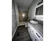 This bathroom features a shower and tub combination and a vanity with a mirror and updated faucet at 6830 Pawnee Trl Se, Acworth, GA 30102