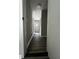 Hallway view leading to the home's entrance and various rooms at 6830 Pawnee Trl Se, Acworth, GA 30102