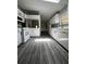 Bright kitchen featuring white cabinets, modern appliances, and seamless flooring at 6830 Pawnee Trl Se, Acworth, GA 30102