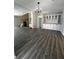 Open-concept living space with ample natural light, built-in storage, and stylish flooring at 6830 Pawnee Trl Se, Acworth, GA 30102