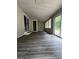 This sunroom features lots of windows and a sliding glass door to the backyard at 6830 Pawnee Trl Se, Acworth, GA 30102