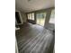 This sunroom features lots of windows and a sliding glass door to the backyard at 6830 Pawnee Trl Se, Acworth, GA 30102