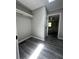 Walk-in closet with built-in storage and access to the adjoining bathroom at 6830 Pawnee Trl Se, Acworth, GA 30102