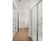 Bathroom hallway leading to the glass-enclosed shower at 2472 Cotton Ln, Douglasville, GA 30135