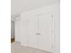 Bedroom featuring neutral carpet, fresh paint, and walk-in closets at 2472 Cotton Ln, Douglasville, GA 30135