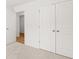 Bedroom featuring neutral carpet, fresh paint, and walk-in closets at 2472 Cotton Ln, Douglasville, GA 30135