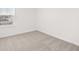 Cozy bedroom featuring neutral carpet and fresh paint at 2472 Cotton Ln, Douglasville, GA 30135