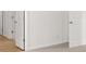 Hallway with neutral carpet and doors at 2472 Cotton Ln, Douglasville, GA 30135