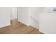 Hallway featuring clean white walls and hardwood floors at 2472 Cotton Ln, Douglasville, GA 30135