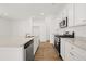 Kitchen with white cabinets, granite countertops and stainless steel appliances at 2472 Cotton Ln, Douglasville, GA 30135