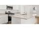 Kitchen featuring stainless steel appliances, granite countertops, and white cabinetry at 2472 Cotton Ln, Douglasville, GA 30135