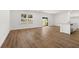 Open concept living area featuring wood-look floors, kitchen, and access to the outdoor space at 2472 Cotton Ln, Douglasville, GA 30135