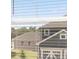 Daytime view out of a sunny window showing a neighboring home at 2472 Cotton Ln, Douglasville, GA 30135