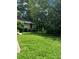 Overgrown backyard of a single story home at 2880 Elizabeth Se St, Smyrna, GA 30080
