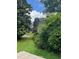 House and yard overgrown with vegetation at 2880 Elizabeth Se St, Smyrna, GA 30080