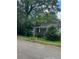 View of a house with overgrown vegetation and a mailbox at 2880 Elizabeth Se St, Smyrna, GA 30080