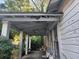 Covered porch with decorative columns and seating area to relax on at 2880 Elizabeth Se St, Smyrna, GA 30080